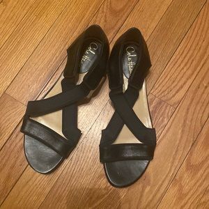 Cole Haan sandals. Black leather with synthetic stretchy crisscrossed straps.